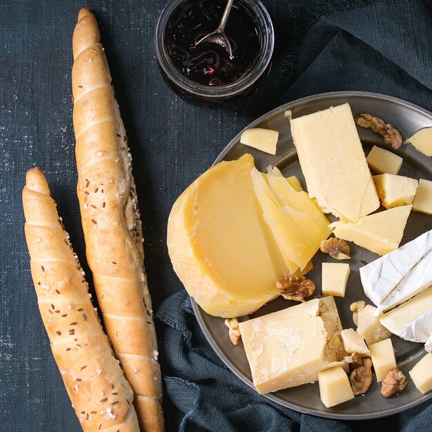 Assortment of cheese on wooden board