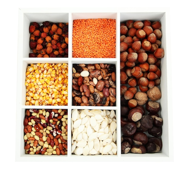 Assortment of chestnutbeans dry briar nuts etc in white wooden box