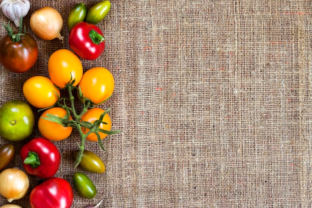 Assortment of colorful fresh vegetables on sackcloth surface