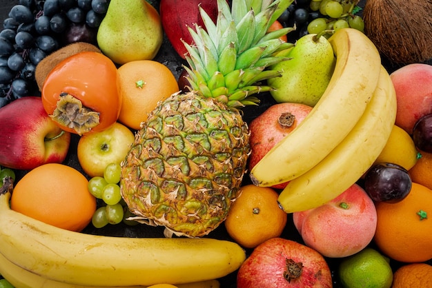 Assortment of colorful ripe tropical fruits top view