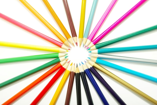 Assortment of coloured pencils on white background