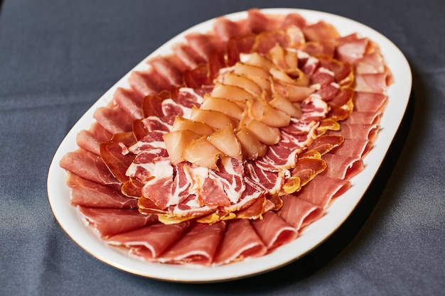 Assortment of delicatessen cold meat salami ham and bacon