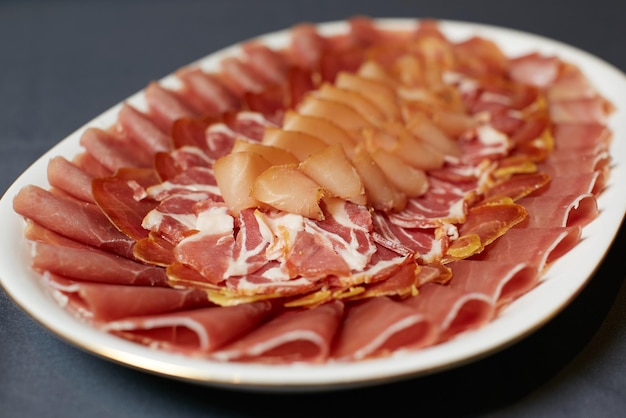 Assortment of delicatessen cold meat salami ham and bacon