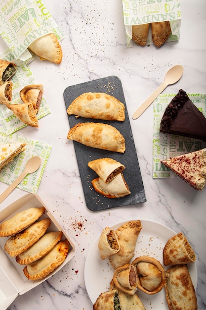 Assortment of delicious Argentinian Empanas on the marble table