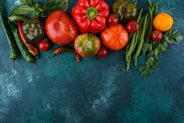 Assortment of different tomatoes pepper and basil