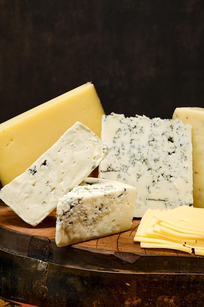 Assortment of different types of cheese closeup view