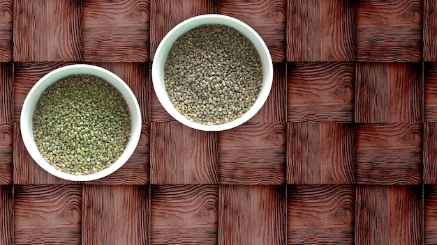 Assortment of dried peas hemp flaxe raisins on wooden table