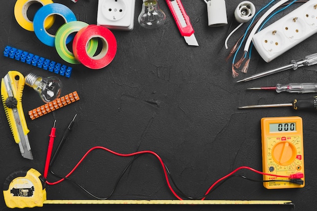 Assortment of electrical tools on table