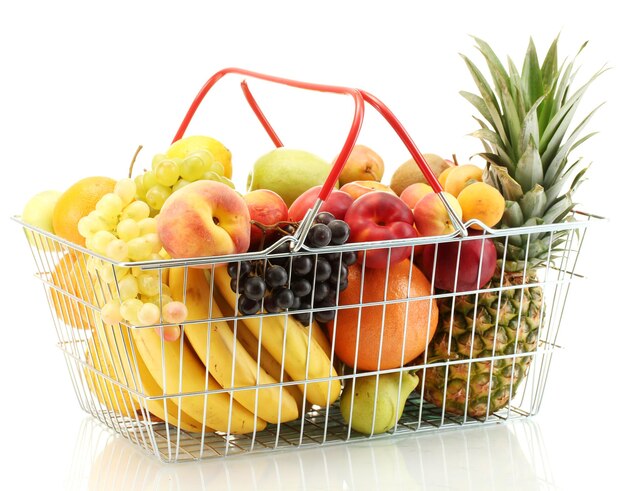 Assortment of exotic fruits in metal basket isolated on white