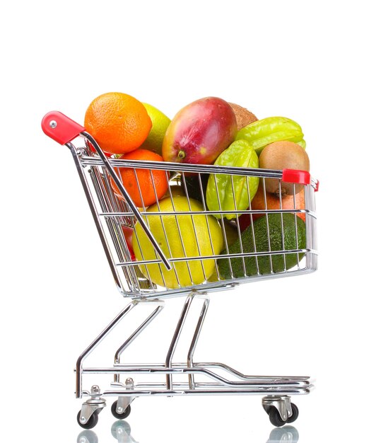 Assortment of exotic fruits in shopping cart isolated on white