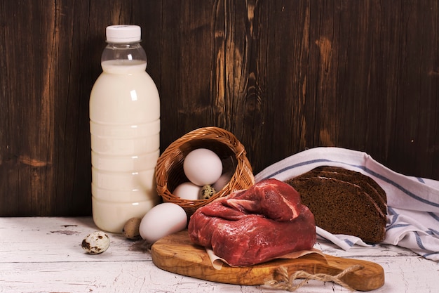 assortment of farmer products over wooden board