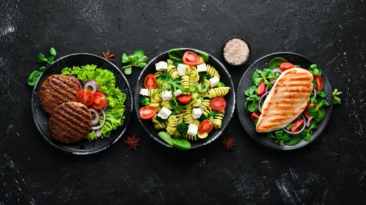 Assortment of food Folk cuisine on a black wooden background Top view Free space for your text Flat lay