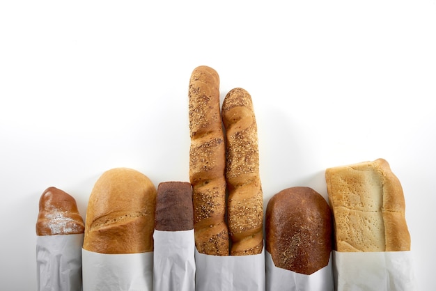 Assortment of fresh bread isolated on white