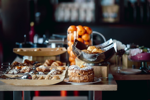 Photo assortment of fresh pastry on table in buffet