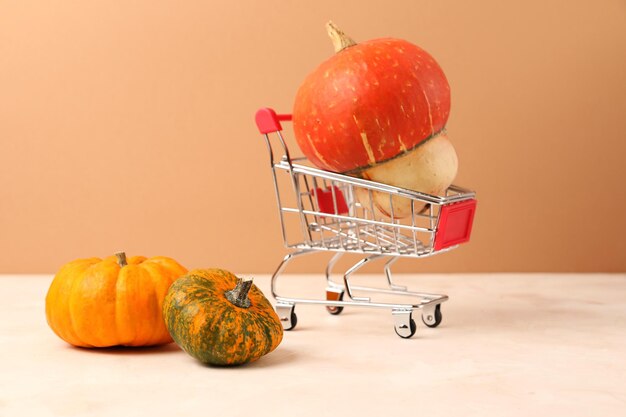 Assortment from pumpkinsFunny pumpkin looks like mushroom in the shopping cart