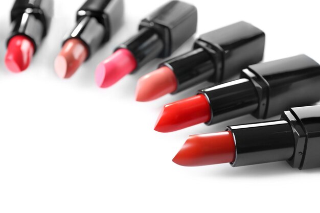 Assortment of lipsticks on white background