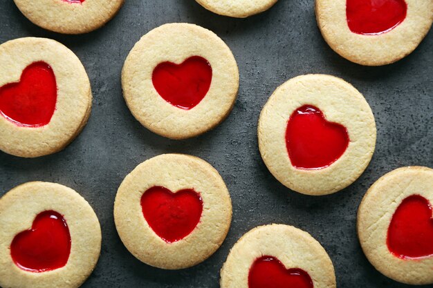 Assortment of love cookies on grey surface