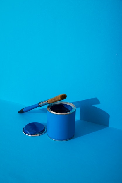 Photo assortment of painting items with blue paint