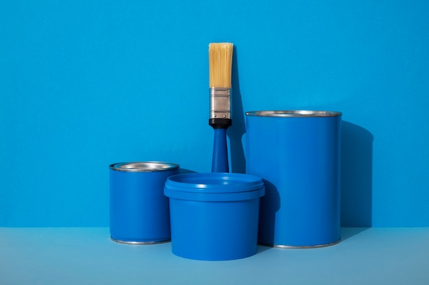 Photo assortment of painting items with blue paint