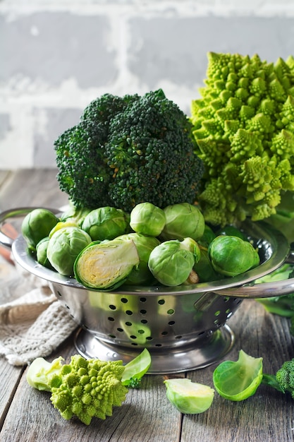 Assortment of raw cabbages on old wood table