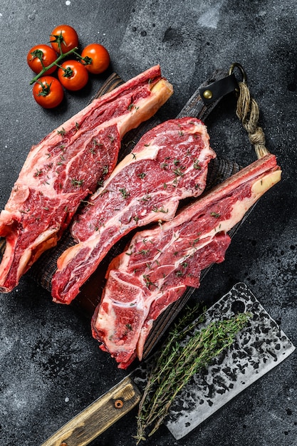 Assortment of raw cuts beef meat steaks on the bone