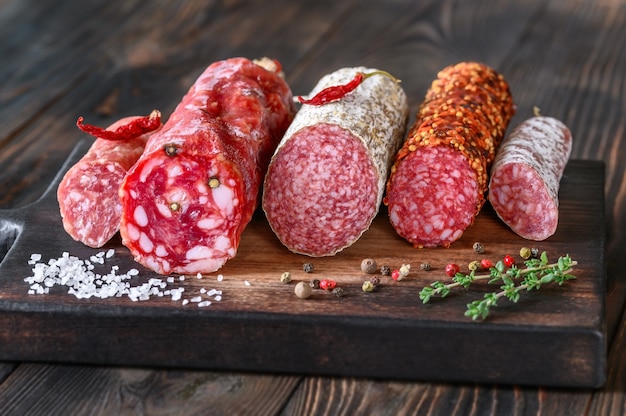 Assortment of salami on the wooden board