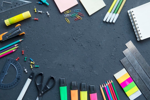 Assortment school supplies shaped a blank frame