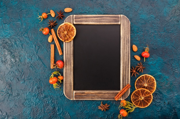 Assortment of spices and chalk blackboard.