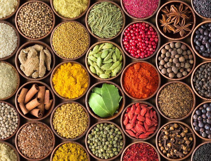 Photo assortment of spices and herbs in bowls