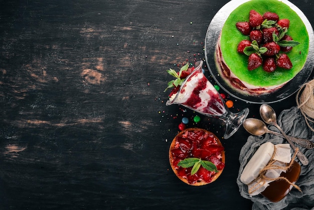 Assortment of Strawberry Desserts On a wooden background Top view Copy space