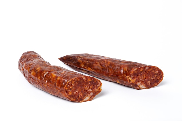 Assortment of typical Spanish homemade sausages with a colorful background. Iberian Chorizo and Salchichon