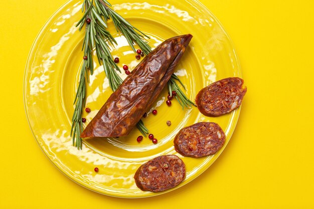 Assortment of typical Spanish homemade sausages with a colorful background. Iberian Chorizo and Salchichon