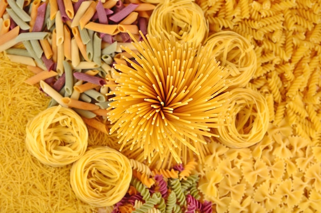 Photo assortment of uncooked italian pasta close up