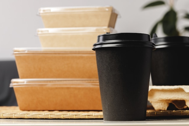 Assortment of various food delivery containers on table close up