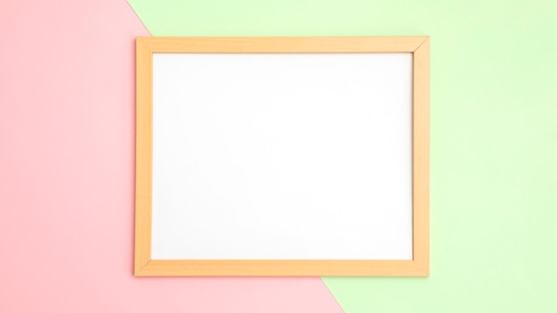 Assortment with empty orange frame on wall