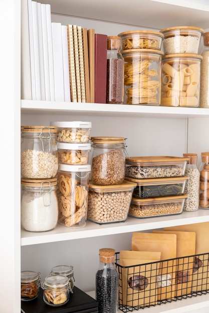 Assortment with food containers and books