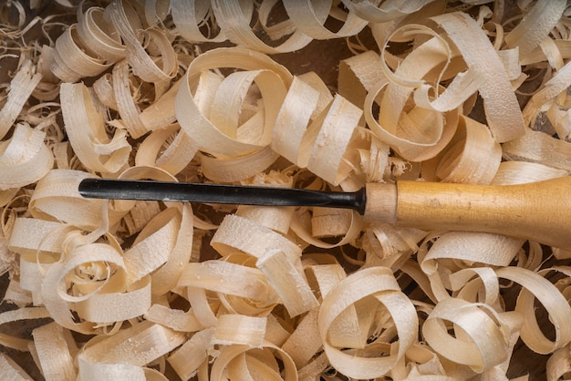 Assortment with wood scraps and tool