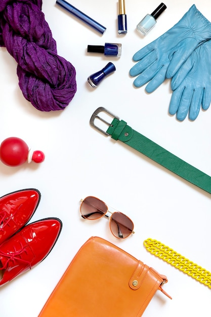 Assortment of womens accessories on a white surface