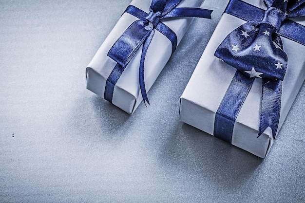 Assortment of wrapped giftboxes on blue background holidays concept