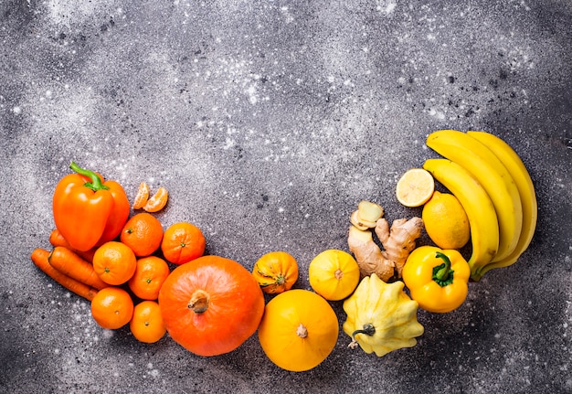 Assortment of yellow and orange fruits and vegetables