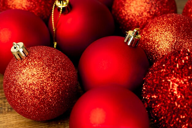 Assortments of red Christmas ornamental baubles closeup