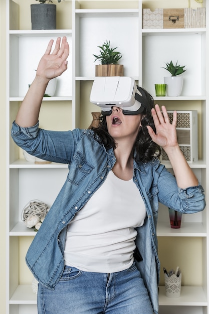 Astonished woman having virtual reality experience