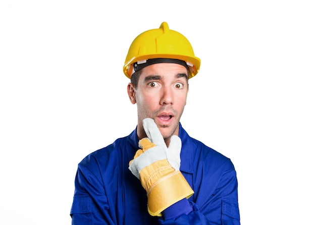 Astonished worker wondering on white background