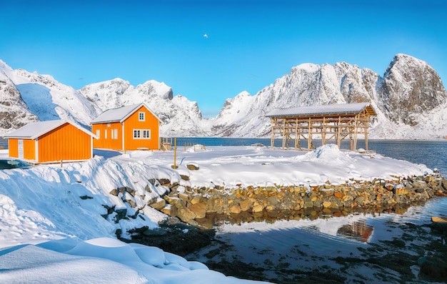 Astonishing winter view of Sakrisoy village and snowy mountaines on background