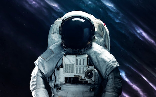 Astronaut. Deep space image, science fiction fantasy in high resolution ideal for wallpaper and print. Elements of this image furnished by NASA