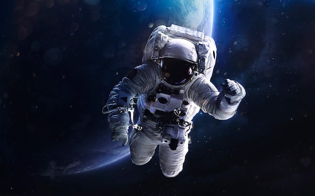 Astronaut. Deep space image, science fiction fantasy in high resolution ideal for wallpaper and print. Elements of this image furnished by NASA