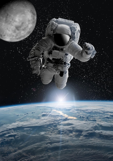 Astronaut in outer open space over the planet .Stars provide the background.erforming a space above planet Earth.Sunrise,sunset.Our home. ISS.Elements of this Image Furnished by NASA.