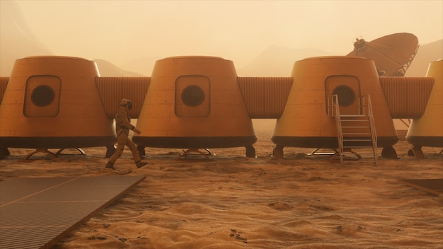 火星の宇宙飛行士、彼の基地の周りを迂回します。基地に沿って歩く宇宙飛行士。