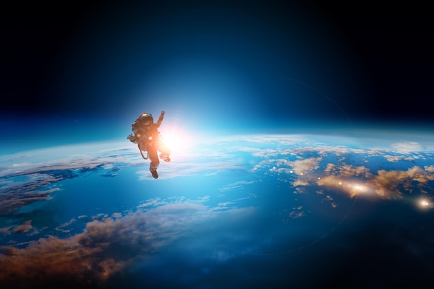 Astronaut in a space-suit in outer space beside a planet