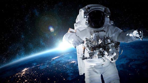 Astronaut spaceman do spacewalk while working for space station